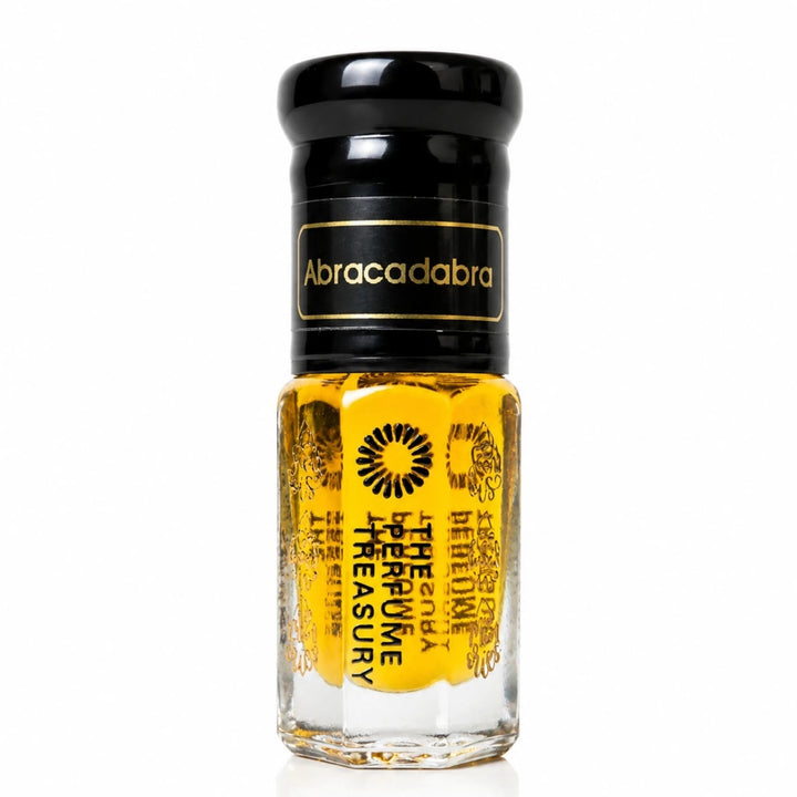 Close-up macro of Abracadabra concentrated perfume oil bottle by The Perfume Treasury, showing luminous golden oil texture and premium glass styling, concentrated perfume oil in clear glass bottle with black cap.