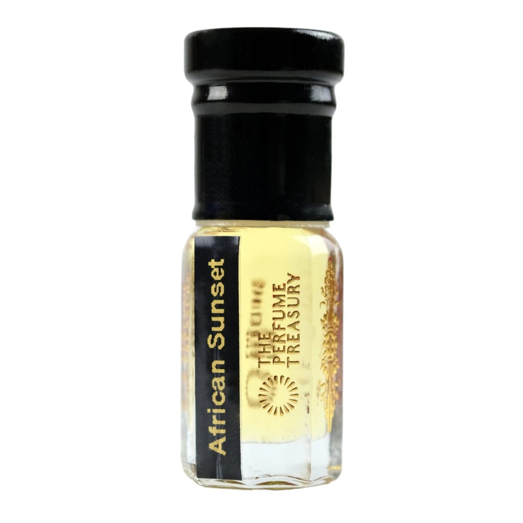 Close-up macro of African Sunset attar perfume oil bottle by The Perfume Treasury, showing pale golden oil texture and glossy clear glass finish, long lasting attar perfume oil in clear glass bottle with black cap.