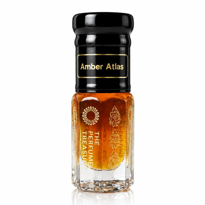 Studio product shot of Amber Atlas luxury attar perfume oil bottle by The Perfume Treasury, featuring rich amber fragrance oil and ornate clear glass bottle with glossy black cap.
