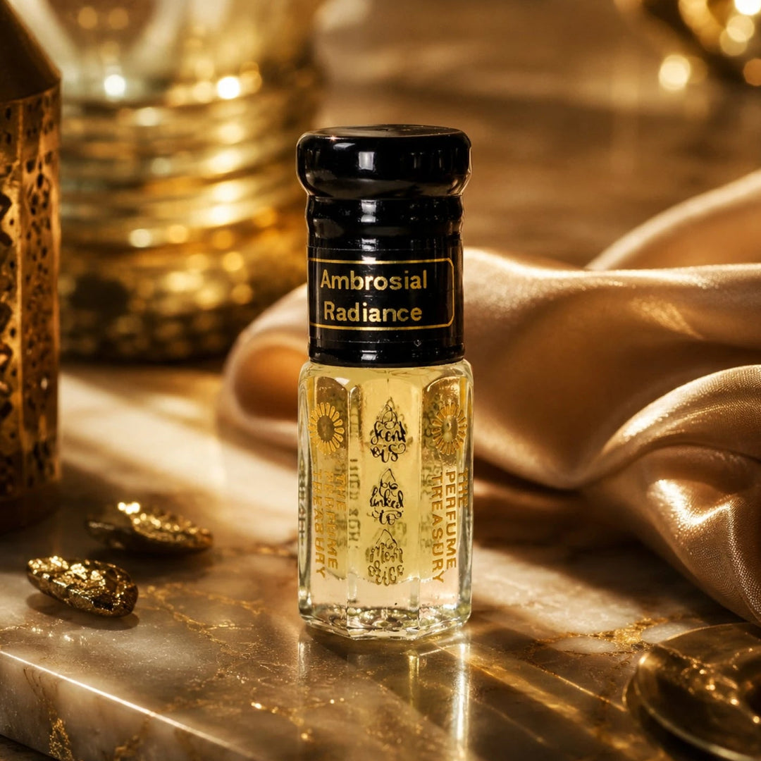 Luxurious lifestyle composition of Ambrosial Radiance Arabian attar perfume bottle placed on polished marble with golden decor, satin fabric and warm ambient lighting for an opulent fragrance presentation.