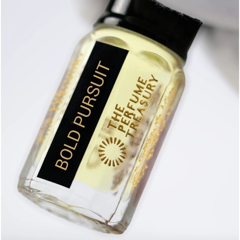 Close-up of Bold Pursuit perfume oil bottle held in white glove, highlighting luxury concentrated fragrance oil by The Perfume Treasury.