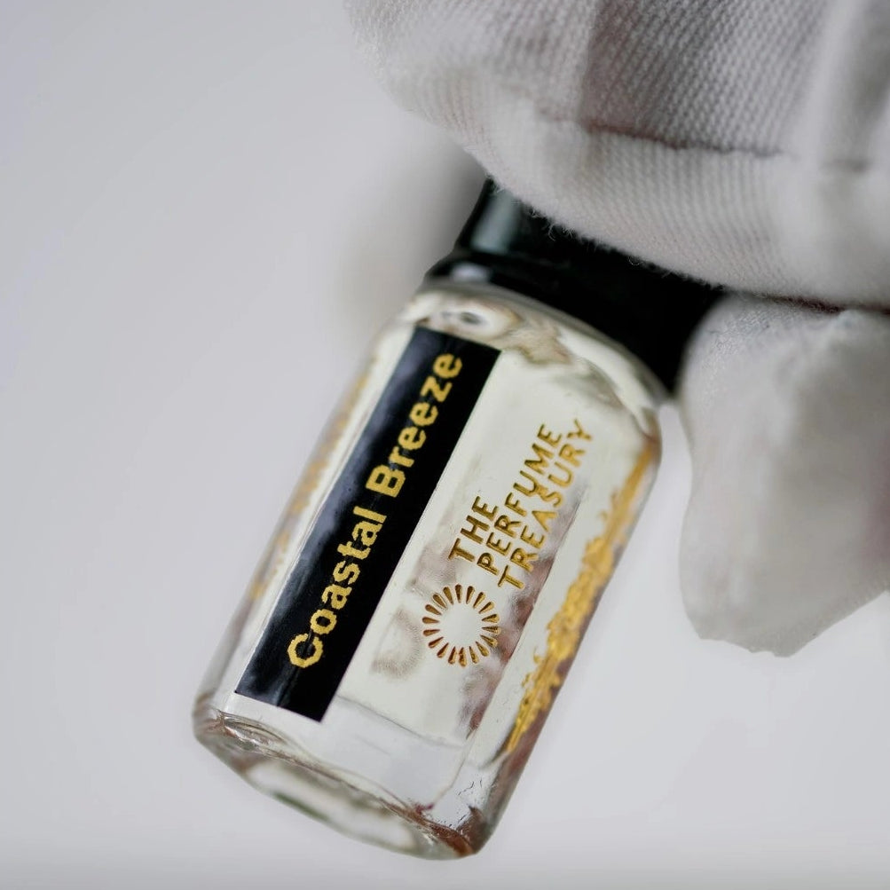Close-up detail of Coastal Breeze perfume oil by The Perfume Treasury, highlighting the luxury glass bottle, concentrated fragrance oil and premium label design.