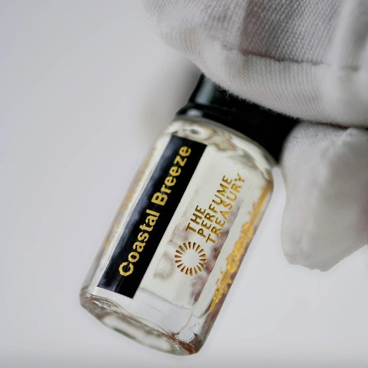 Close-up detail of Coastal Breeze perfume oil by The Perfume Treasury, highlighting the luxury glass bottle, concentrated fragrance oil and premium label design.