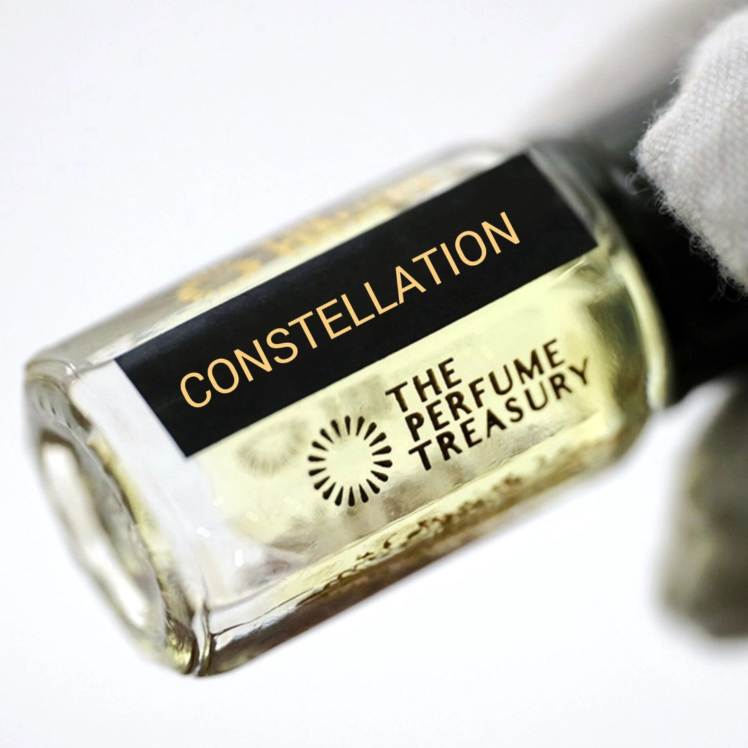Close-up detail of Constellation perfume oil by The Perfume Treasury, highlighting the luxury glass bottle, concentrated fragrance oil and premium label design.