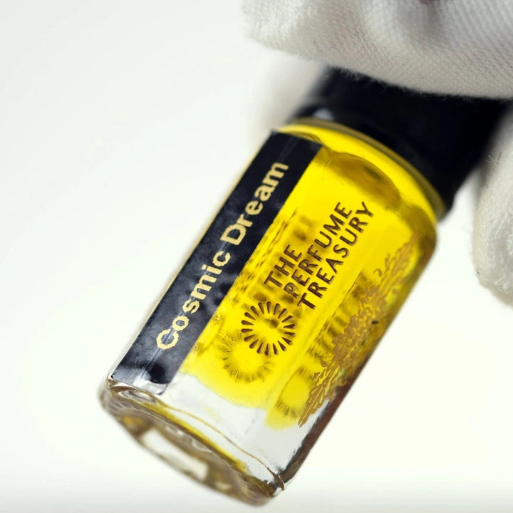 Close-up detail of Cosmic Dream perfume oil by The Perfume Treasury, highlighting the luxury glass bottle, concentrated fragrance oil and premium label design.