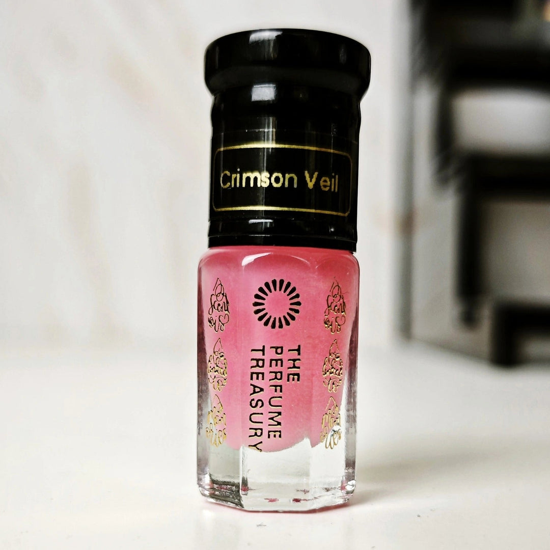Crimson Veil pink musk tahara perfume oil bottle by The Perfume Treasury with glossy black cap and soft luxury background.