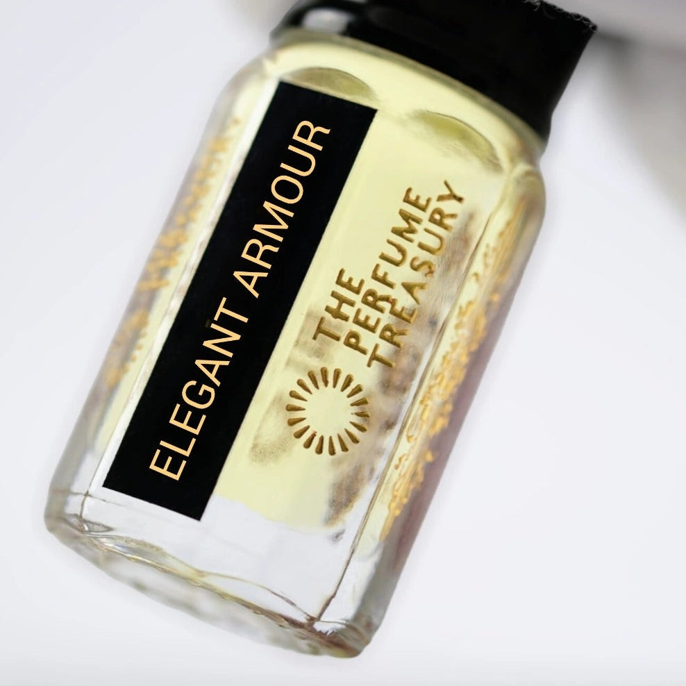 Close-up image of Elegant Armour attar perfume oil by The Perfume Treasury held in a white glove, highlighting the luxury bottle and premium fragrance oil.