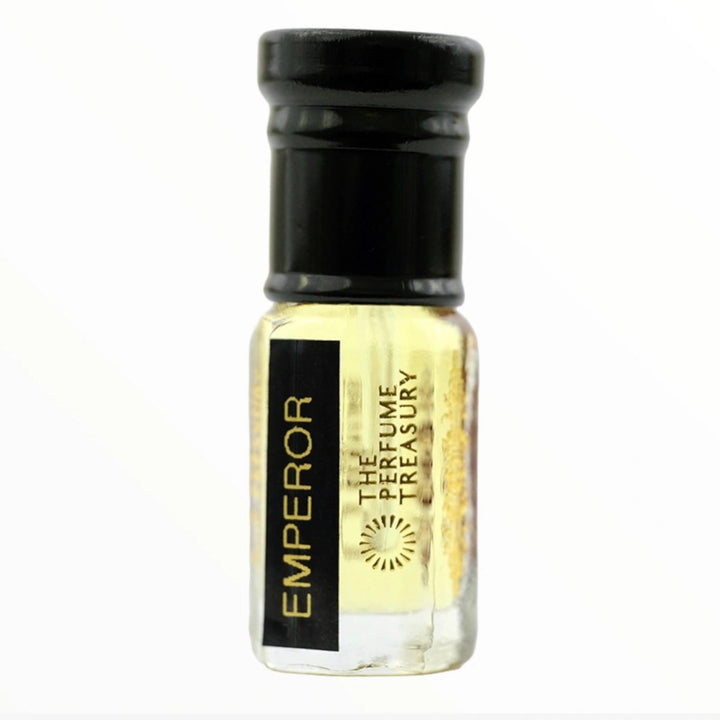 Emperor attar perfume oil by The Perfume Treasury displayed in a premium clear glass bottle with black cap and pale golden fragrance oil, photographed on a clean white background for ecommerce product listings.