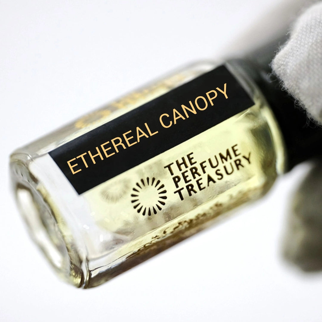 Close-up angled image of Ethereal Canopy attar perfume oil by The Perfume Treasury held in a white glove, highlighting the luxury bottle design and premium alcohol-free perfume oil presentation.