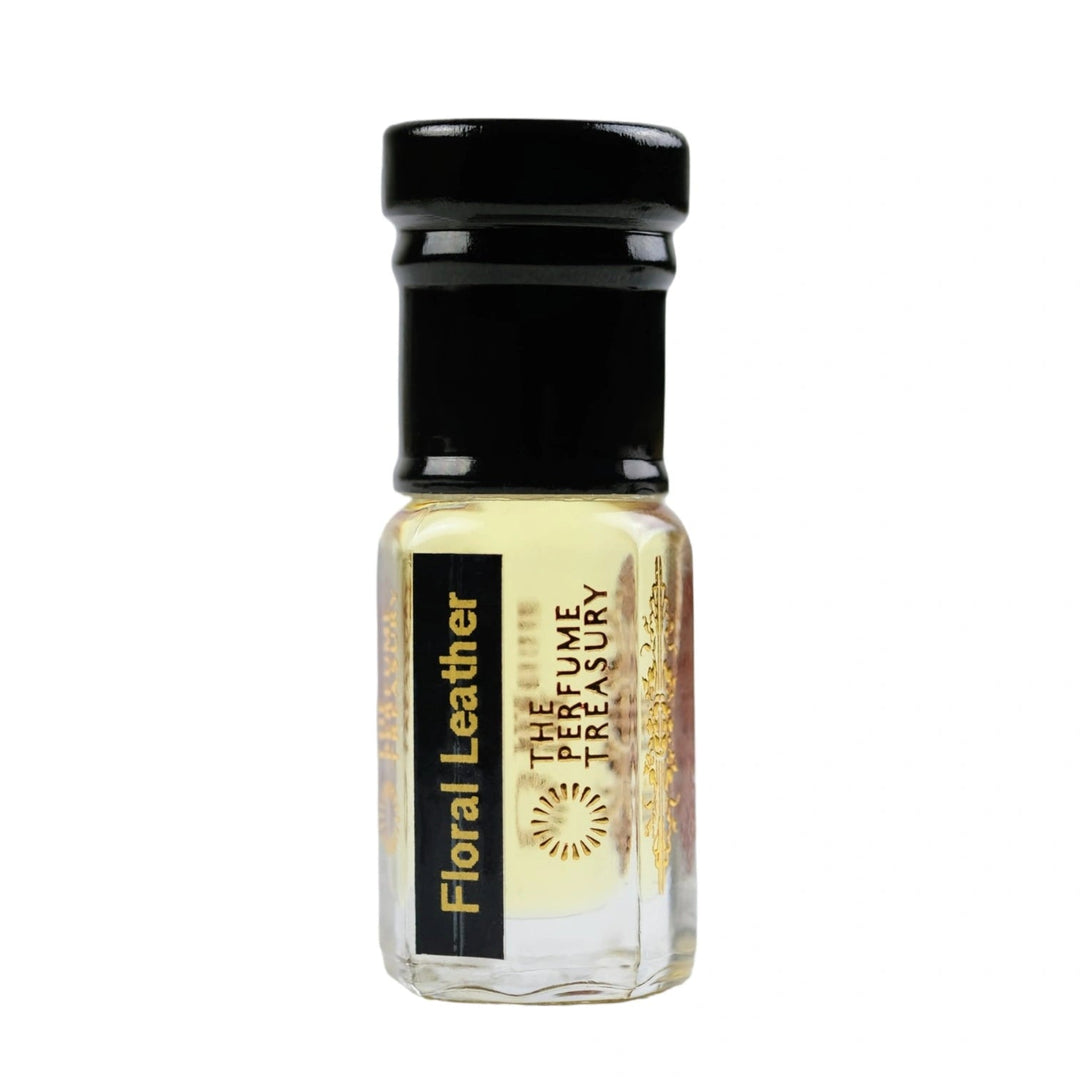 Floral Leather attar perfume oil by The Perfume Treasury in a clear glass bottle with pale golden fragrance oil and black cap.