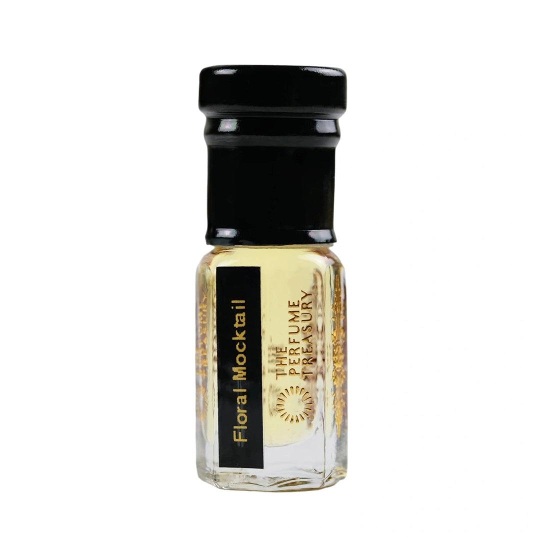 Floral Mocktail attar perfume oil by The Perfume Treasury in a clear glass bottle with pale golden fragrance oil and black cap.