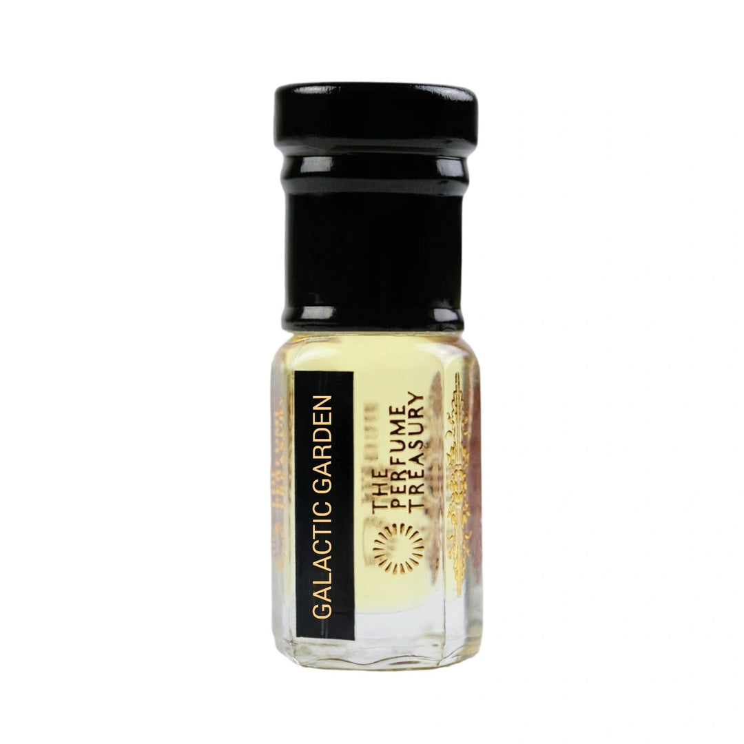 Galactic Garden attar perfume oil by The Perfume Treasury in a clear glass bottle with pale golden fragrance oil, black cap and luxury gold branding.