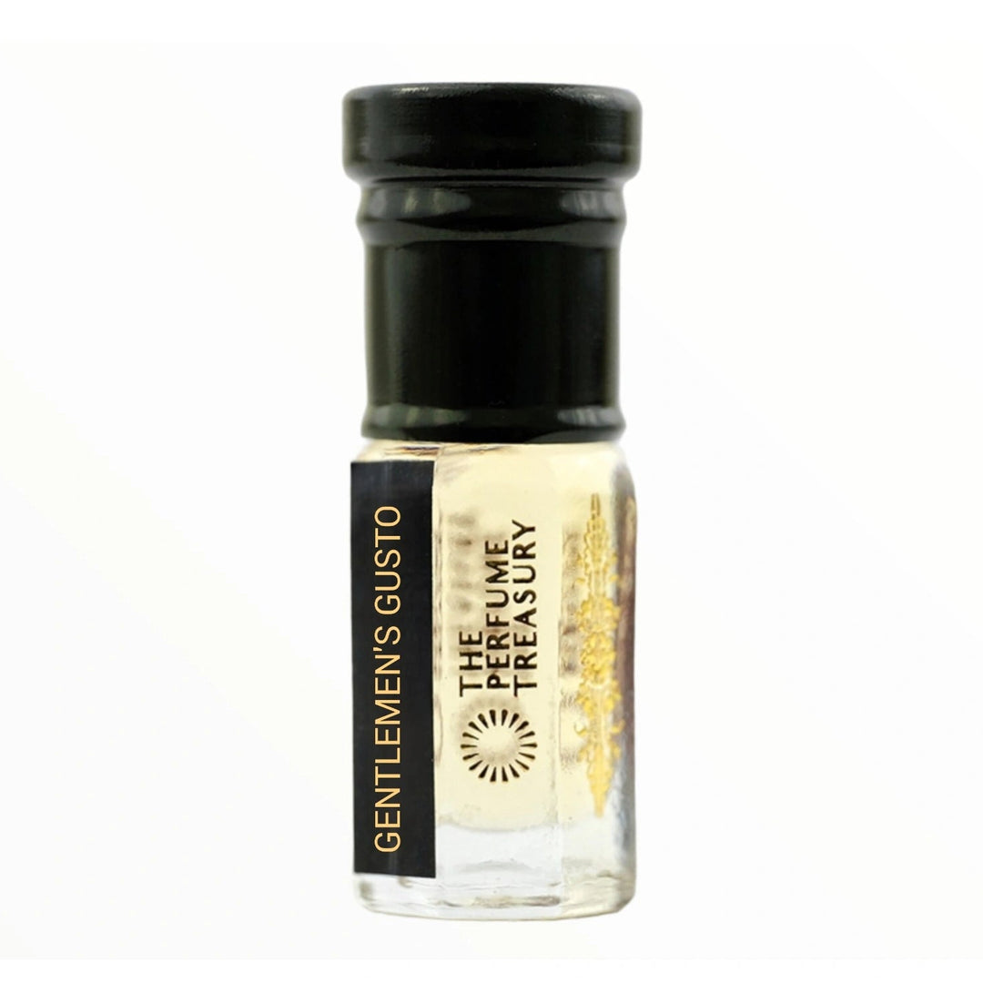 Gentlemen's Gusto attar perfume oil by The Perfume Treasury in a clear glass bottle with pale golden fragrance oil, black cap and luxury gold branding.