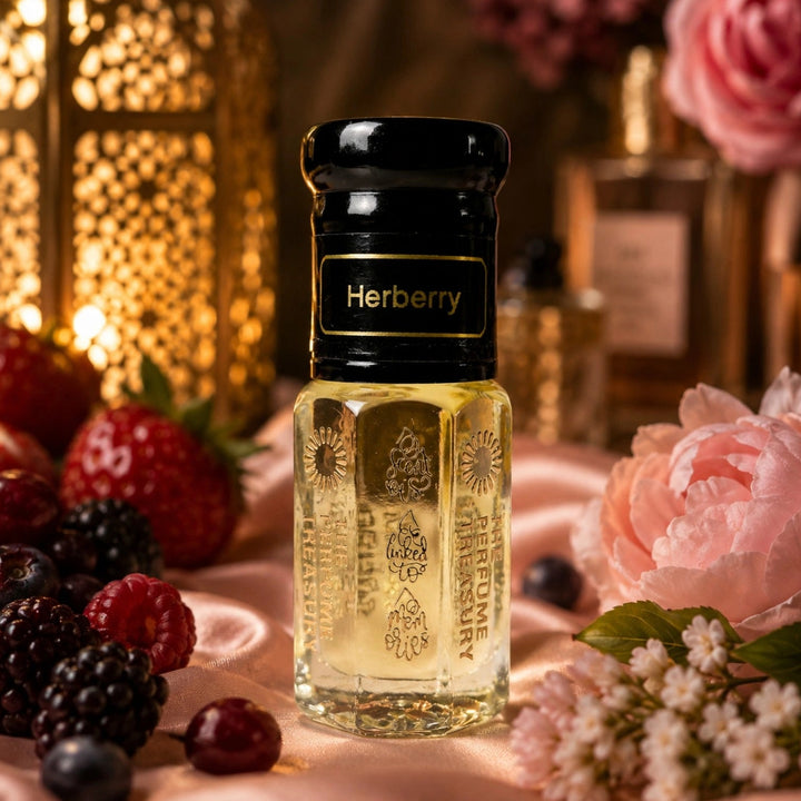 Herberry Attar Perfume Oil by The Perfume Treasury displayed on soft satin surrounded by fresh berries, delicate pink flowers and warm golden lighting, creating a luxurious fruity floral fragrance setting.