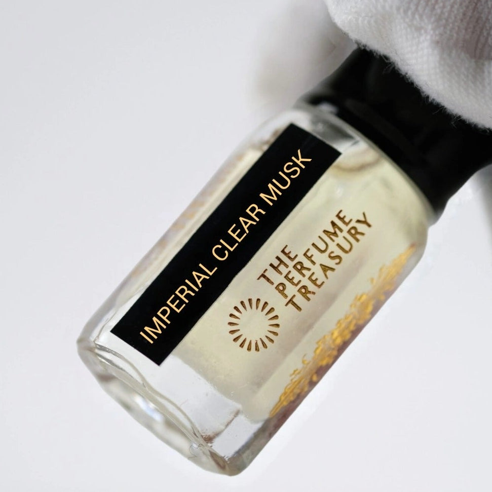 Close-up of Imperial Clear Musk Tahara perfume oil bottle held in white glove, highlighting luxurious clean musk fragrance oil by The Perfume Treasury.