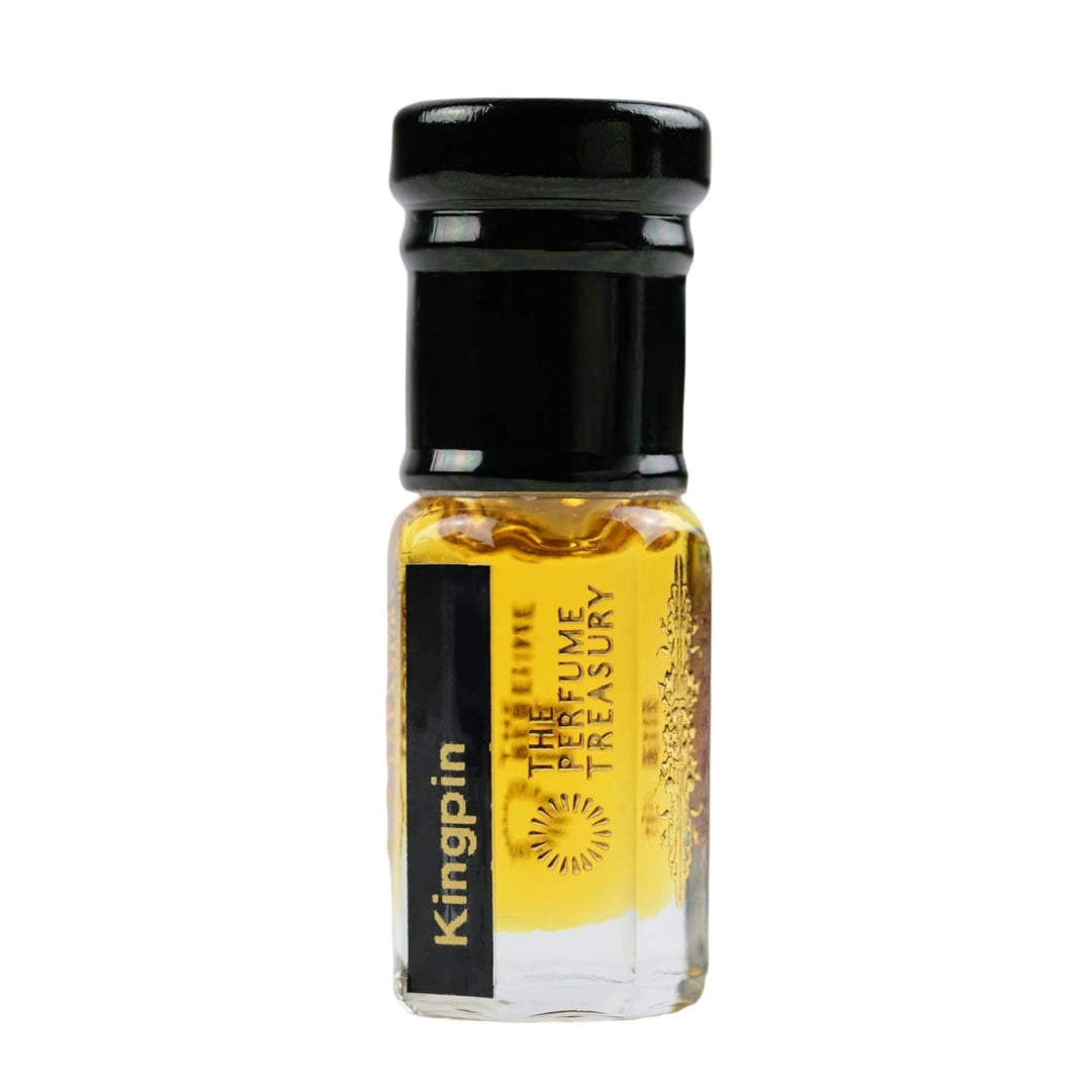 Kingpin Perfume Oil by The Perfume Treasury in a clear glass attar bottle filled with rich golden fragrance oil on a white background.