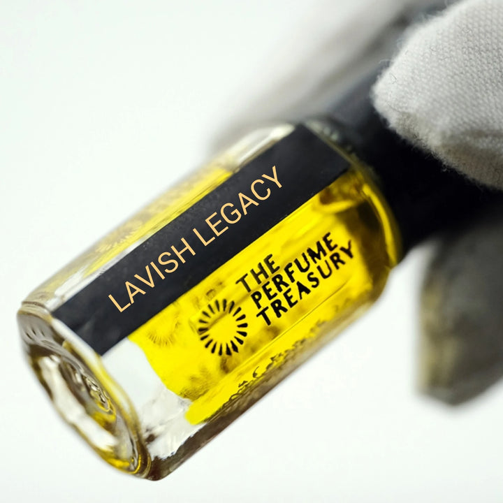 Close-up of Lavish Legacy perfume oil by The Perfume Treasury highlighting the black and gold label and golden fragrance oil.
