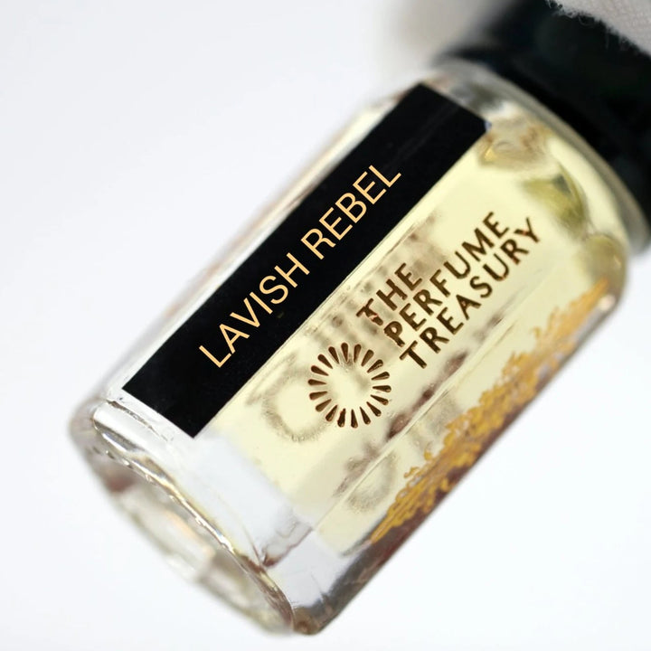 Close-up of Lavish Rebel perfume oil by The Perfume Treasury showing the black and gold bottle label.