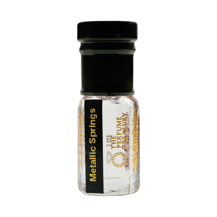 Metallic Springs perfume oil by The Perfume Treasury in a clear glass attar bottle with black cap and clear fragrance oil.