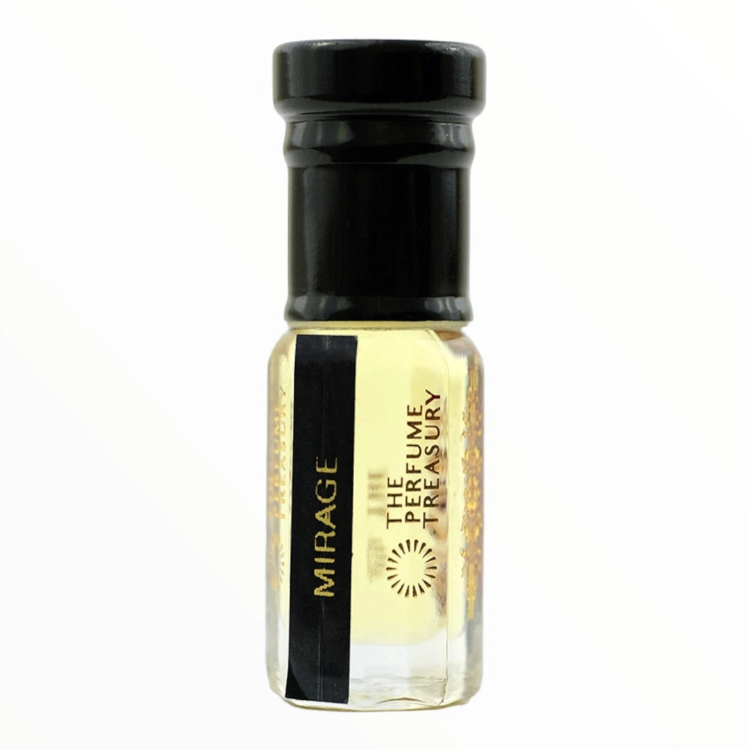Small clear glass perfume oil bottle with black cap, Mirage 3ml attar perfume oil by The Perfume Treasury, soft pale golden translucent fragrance oil on white background.