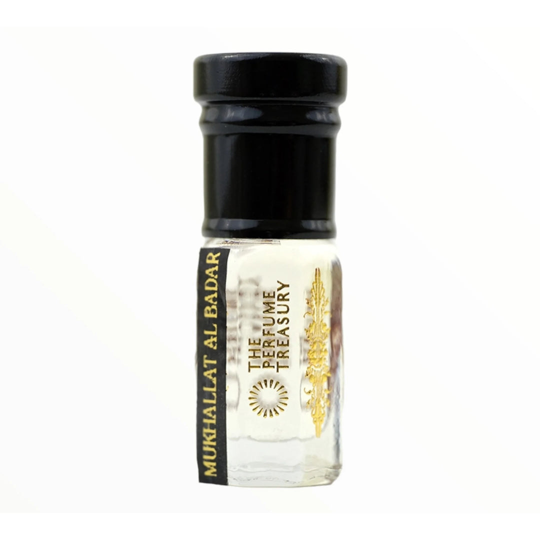 Mukhallat Al Badar perfume oil by The Perfume Treasury in a clear glass attar bottle with black cap and pale golden fragrance oil.