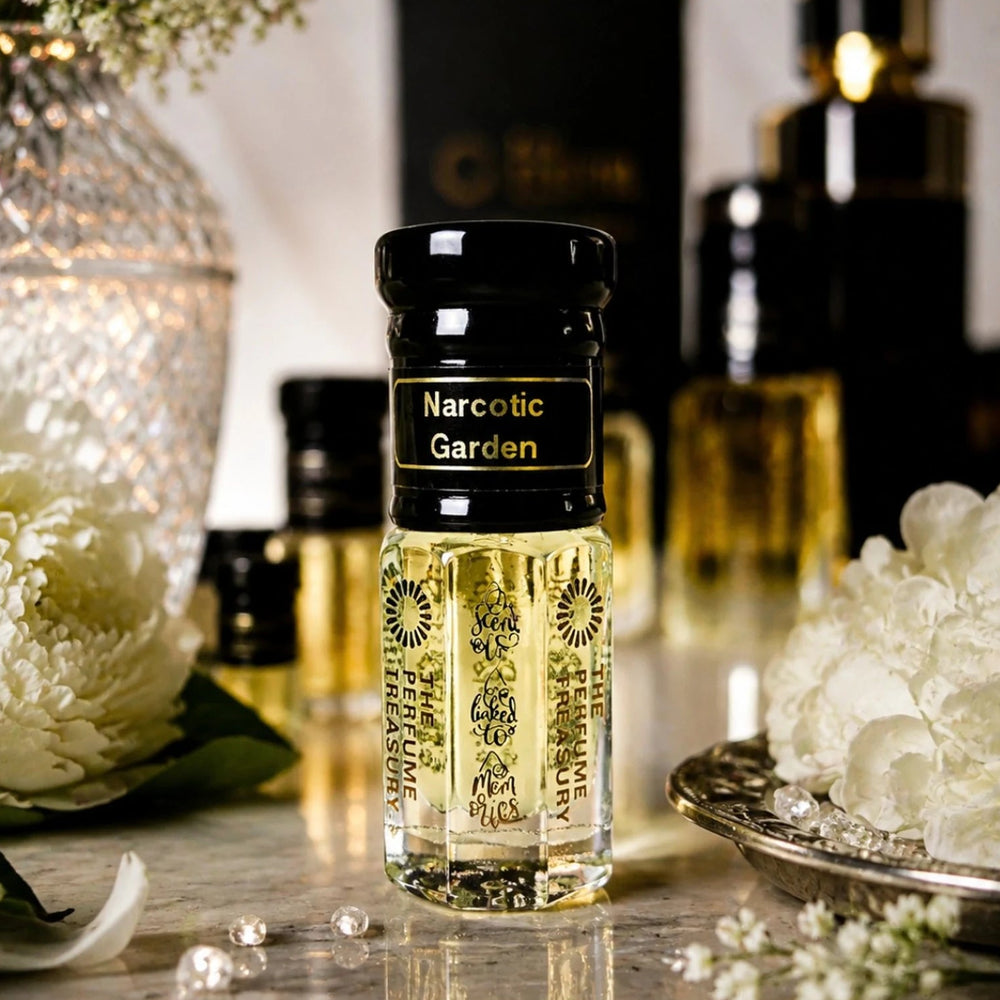 Narcotic Garden perfume oil by The Perfume Treasury displayed in an elegant floral setting with white flowers, crystal details and luxurious fragrance bottles.