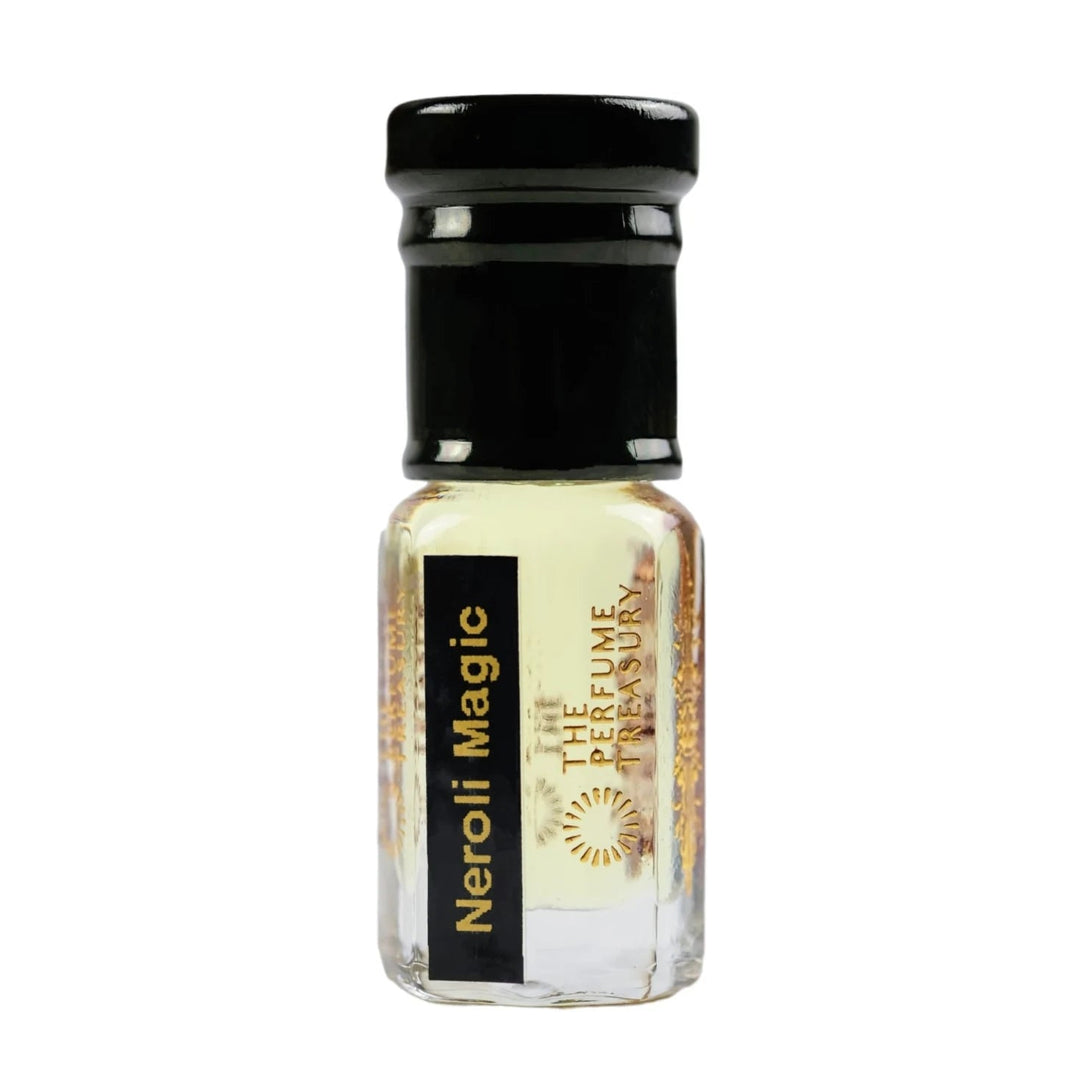 Neroli Magic perfume oil by The Perfume Treasury in a clear glass attar bottle with black cap and pale golden fragrance oil.