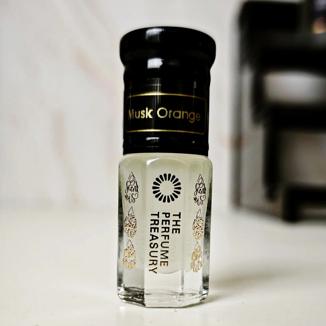 Orange Musk Tahara perfume oil bottle display image featuring a fresh citrus musk fragrance oil in an artisan glass bottle, showcasing bright orange notes, clean white musk and a smooth uplifting scent by The Perfume Treasury.