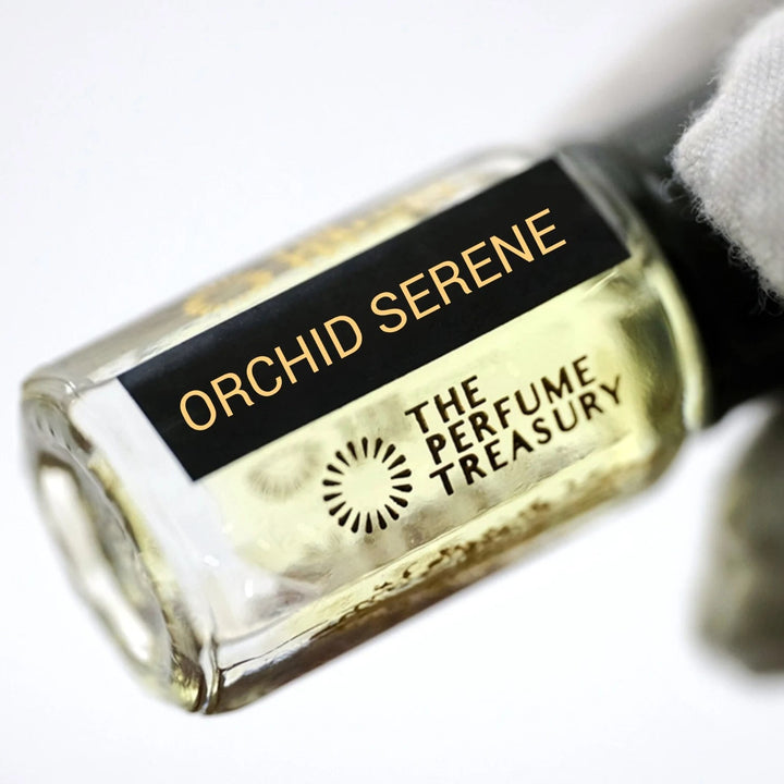 Orchid Serene perfume oil by The Perfume Treasury shown in a close-up view highlighting the bottle and fragrance label.