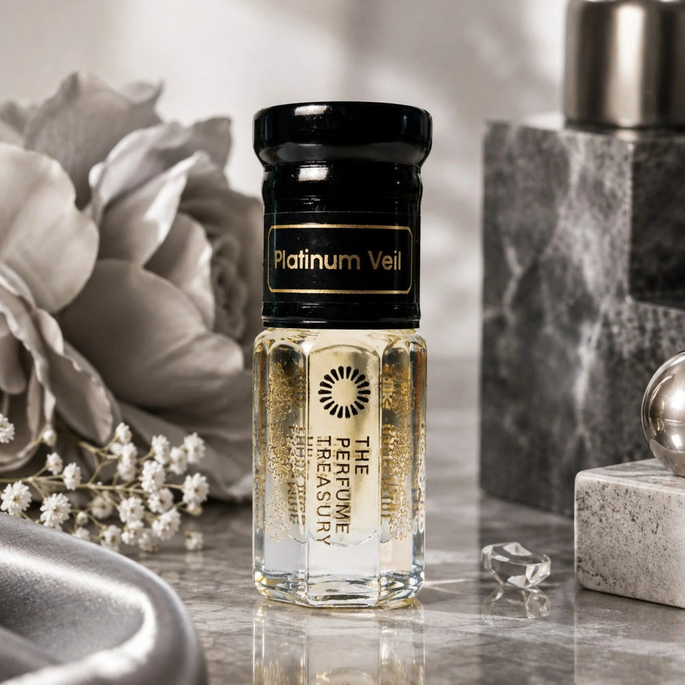 Platinum Veil perfume oil by The Perfume Treasury displayed in an elegant silver and grey setting with flowers, marble and polished metallic accents.