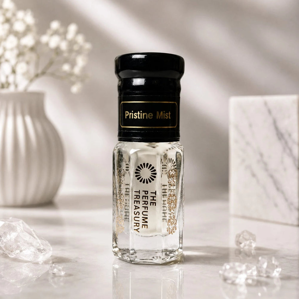 Pristine Mist perfume oil by The Perfume Treasury displayed in a clean, elegant setting with white flowers, marble and clear crystal accents.