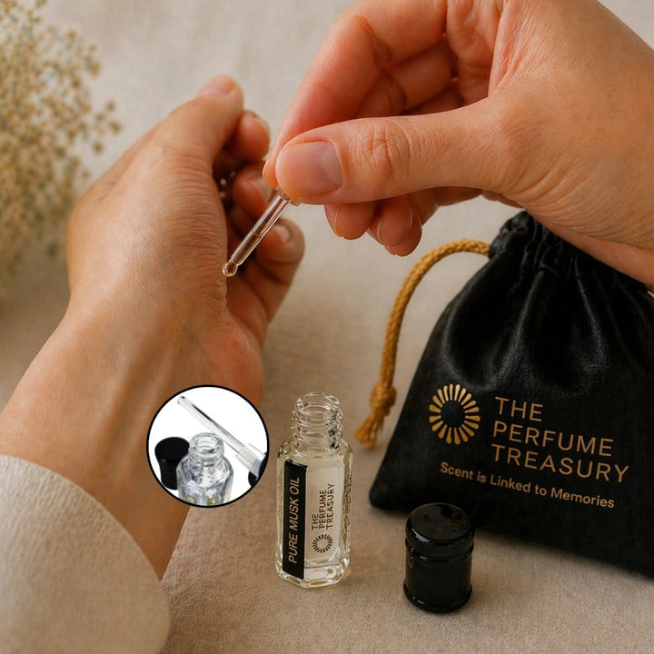 Applying Pure Musk perfume oil with glass applicator by The Perfume Treasury, showing smooth skin application.