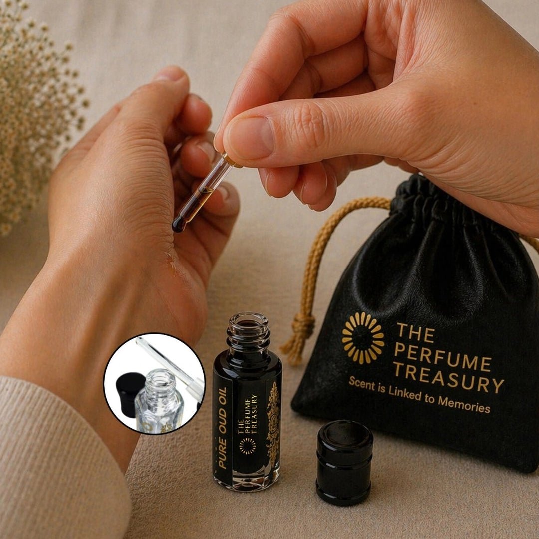 Applying dark Pure Oud perfume oil with glass applicator by The Perfume Treasury, highlighting rich and intense fragrance oil texture.