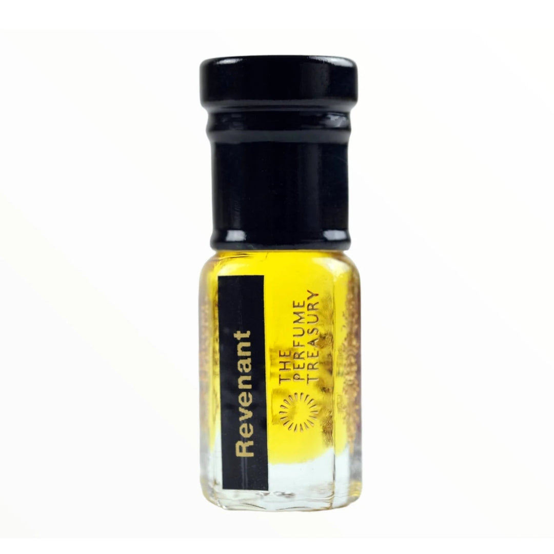 Revenant perfume oil by The Perfume Treasury in a clear glass bottle with black cap and vibrant golden fragrance oil.