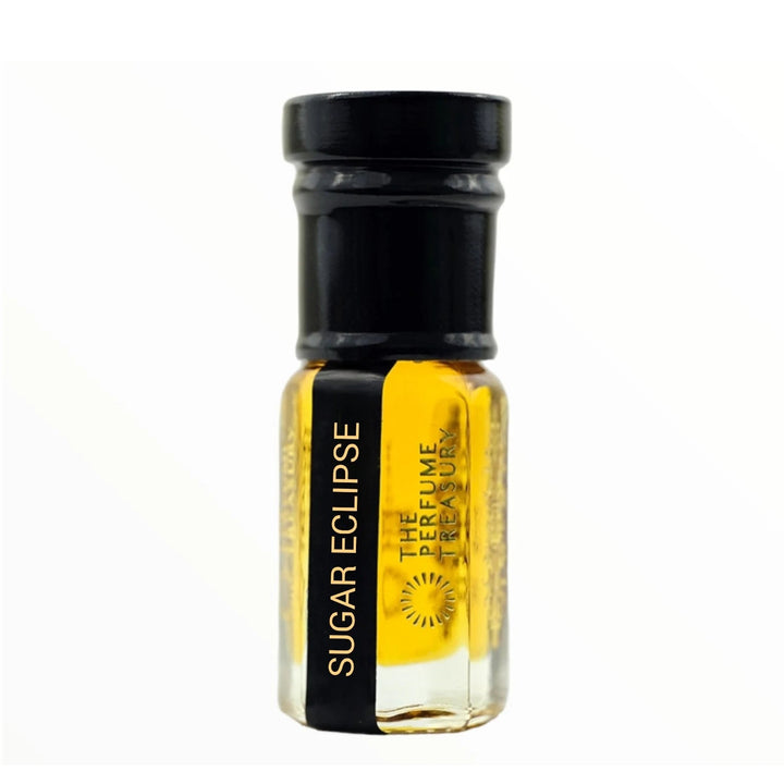 Sugar Eclipse perfume oil by The Perfume Treasury in a clear glass bottle filled with rich golden fragrance oil, glossy black lid and black gold label on a white background