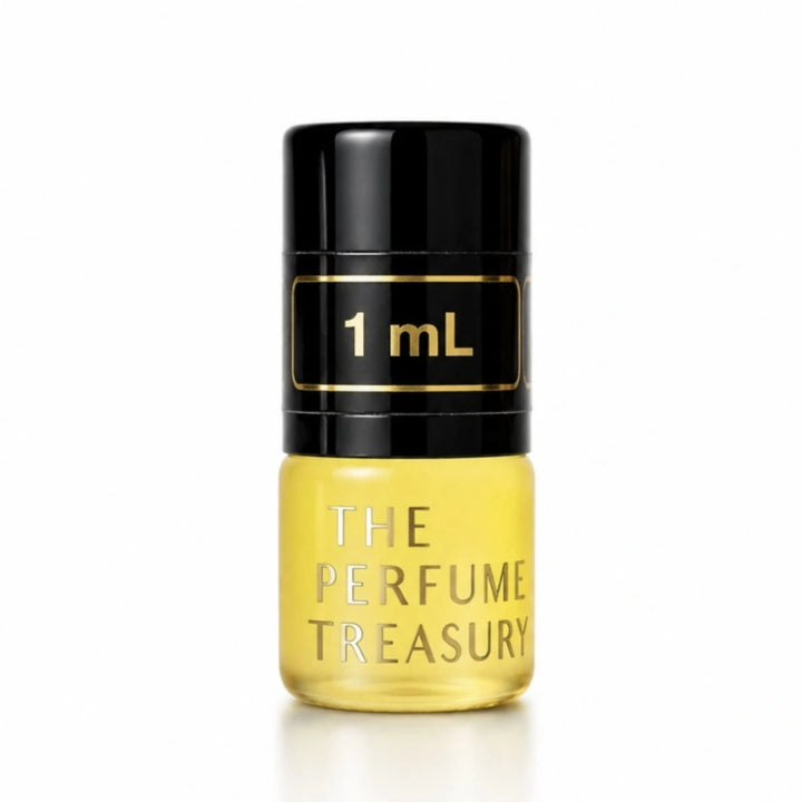 Close-up macro of The Perfume Treasury 1ml attar perfume oil bottle, showing silky golden oil texture and matte frosted glass finish, long lasting attar perfume oil in clear glass bottle with black cap.