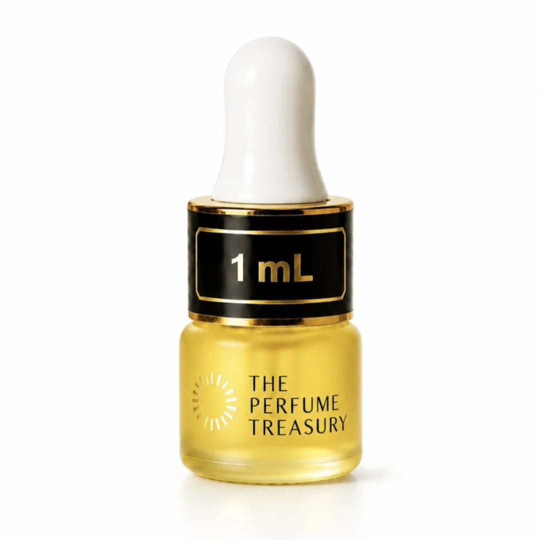 Close-up macro of The Perfume Treasury 1ml attar perfume oil bottle, showing silky concentrated oil texture and premium frosted glass finish, concentrated perfume oil in frosted glass bottle with black cap.