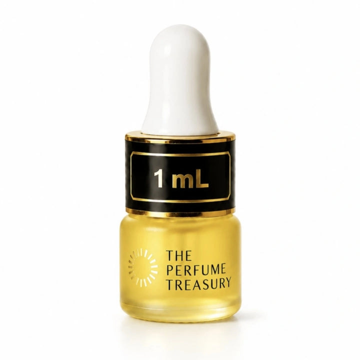 Close-up macro of The Perfume Treasury 1ml attar perfume oil bottle, showing silky concentrated oil texture and premium frosted glass finish, concentrated perfume oil in frosted glass bottle with black cap.