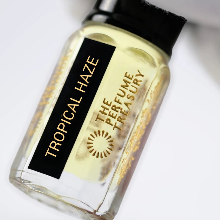 Close-up of Tropical Haze perfume oil by The Perfume Treasury showing the black and gold bottle label