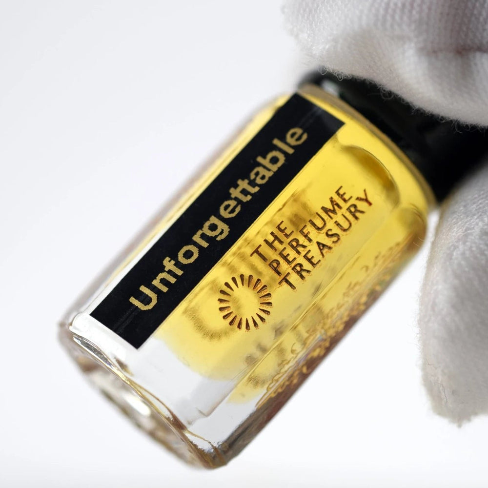 Close-up of Unforgettable perfume oil by The Perfume Treasury showing the clear glass bottle and branded label