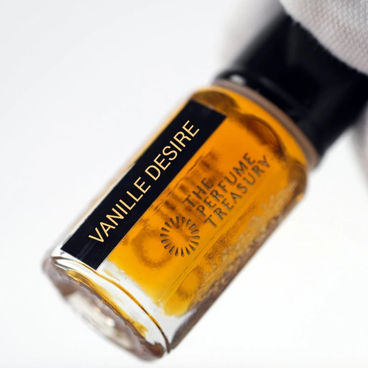 Close-up of Vanille Desire perfume oil by The Perfume Treasury showing the golden oil and branded bottle label