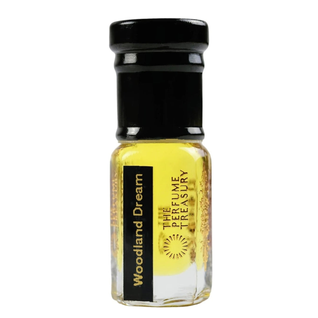 Woodland Dream attar perfume oil 3ml by The Perfume Treasury with rich golden fragrance oil in clear glass bottle on white background.