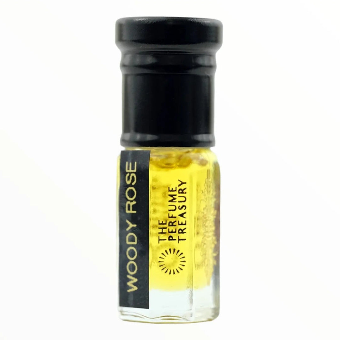 Woody Rose 3ml attar perfume oil bottle by The Perfume Treasury with golden fragrance oil, clear glass bottle with black cap on white background.